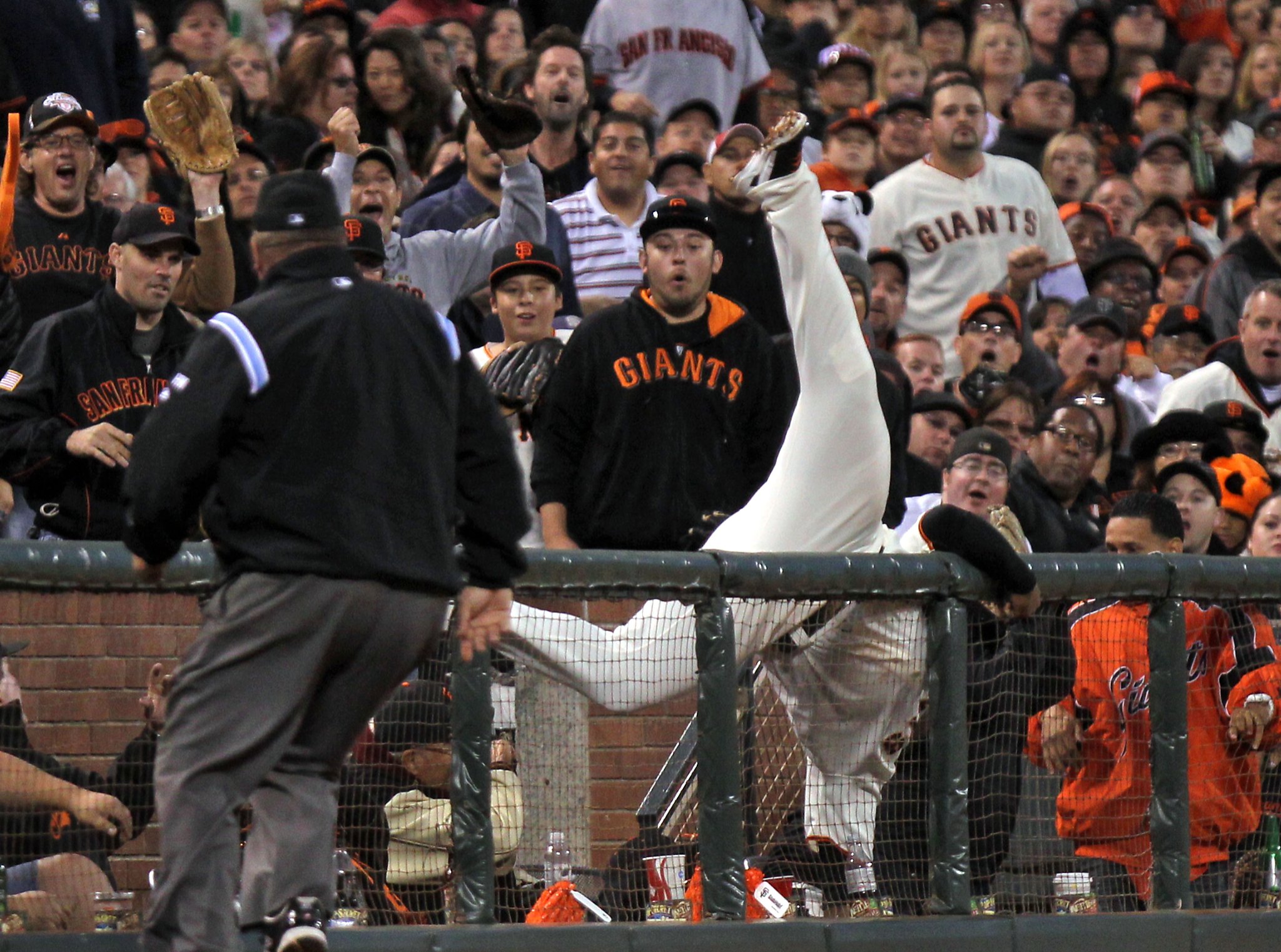 Giants Pablo Sandoval slides into third base in the fourth inning