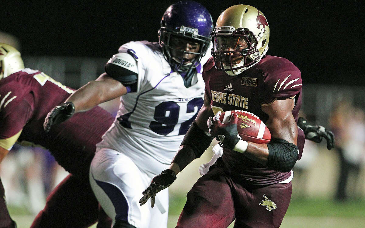Bobcat running back Marcus Curry slips away from a tackler as Texas State hosts Stephen F. Austin at Bobcat Stadium on September 22, 2012.