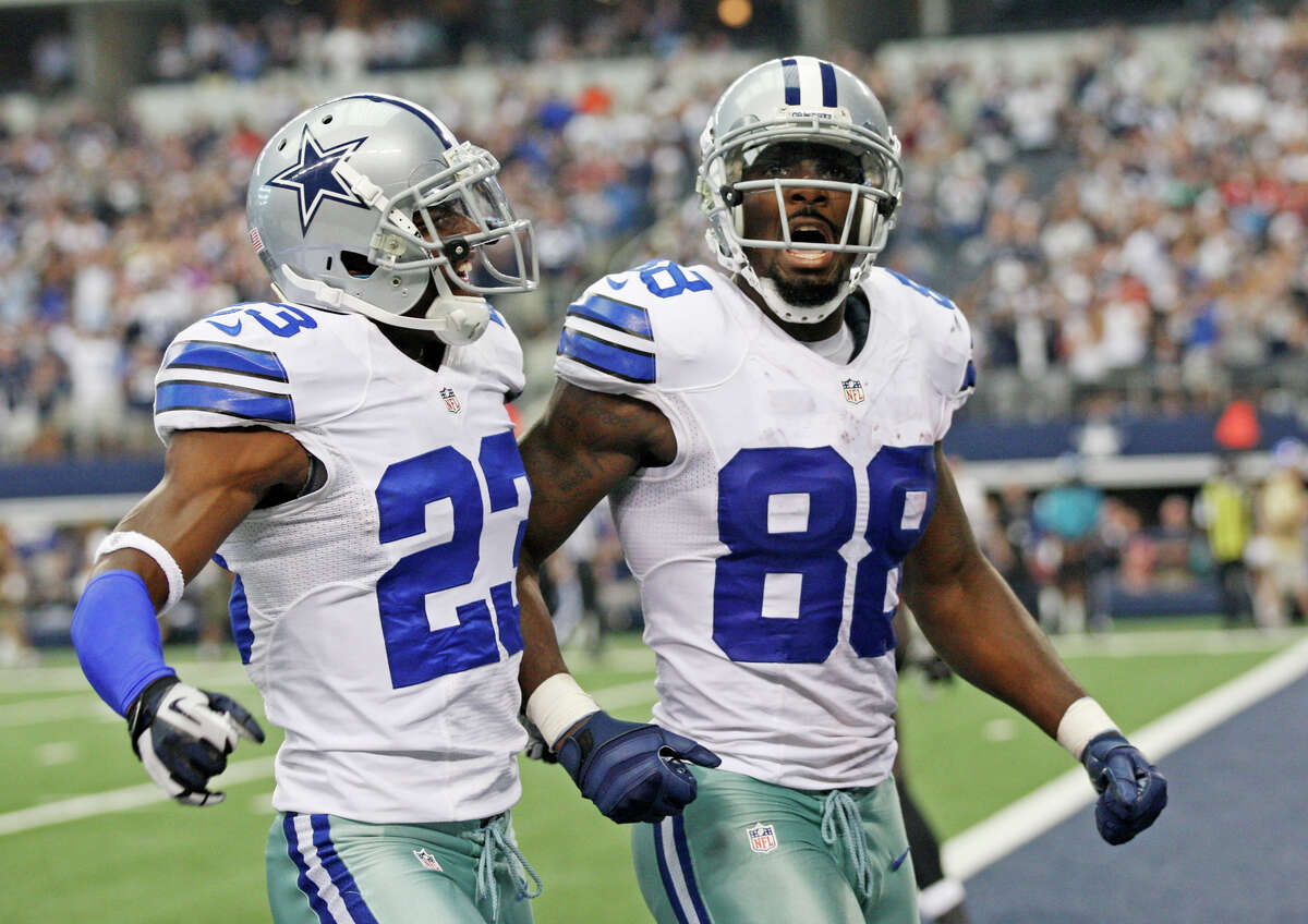 Dallas Cowboys's wide receiver Dez Bryant, right, celebrates a 44-yard punt return with LeQuan Lewis in second half against the Tampa Bay Buccaneers at Cowboys Stadium in Arlington, Texas, Sunday Sept. 23, 2012. The Cowboys won 16-10.
