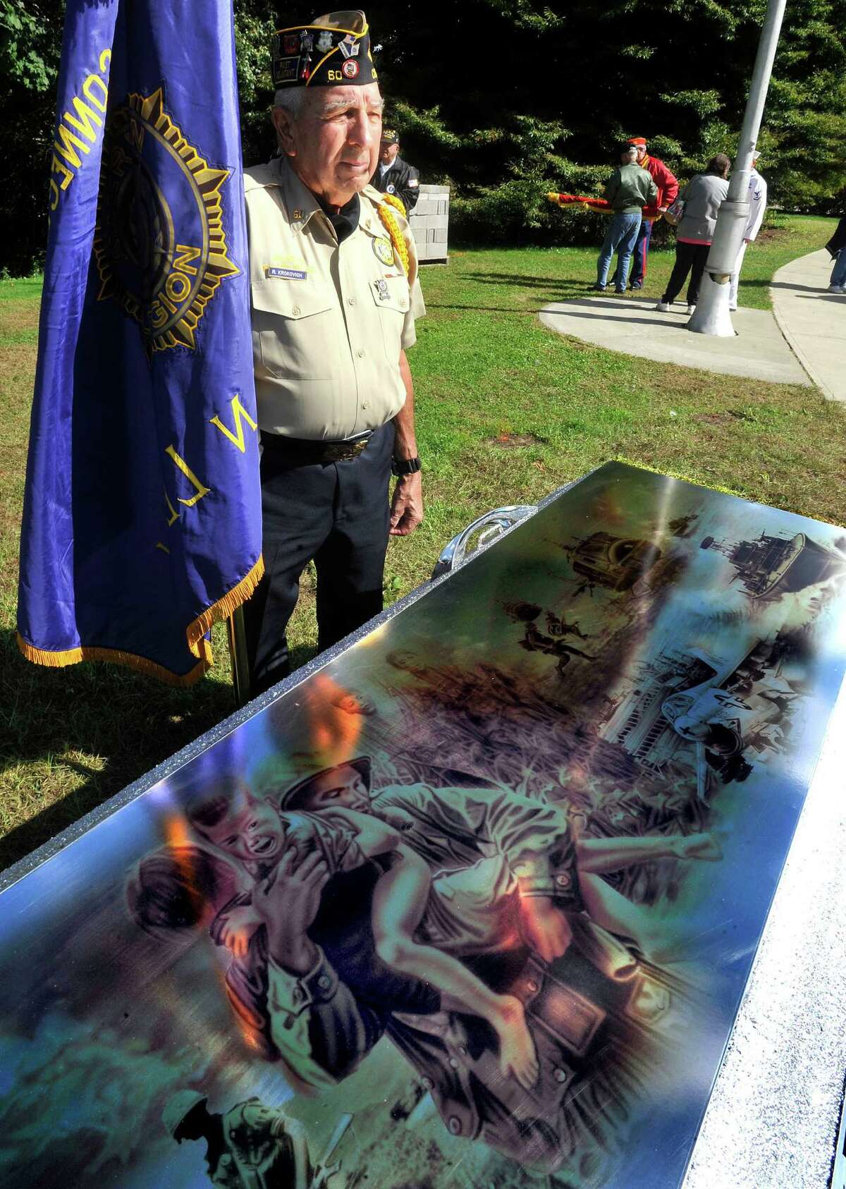 Robert Krokovich Sr. of the American Legion stands above a vault containing memorabilia following a closing ceremony for the Dignity Memorial Vietnam Wall in Danbury Monday, Sept. 24, 2012.