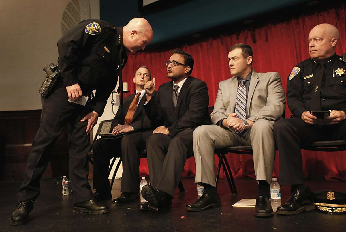 San Francisco Chief of Police Greg Suhr, left talks with San Francisco Supervisor David Campos of District 9, as they and other officers address the public at a community meeting, Monday Sept. 24, 2012 to discuss last week's non-fatal officer involved shooting, in San Francisco, Calif. The shooting was the subject of last weeks protests which broke out into destruction of several businesses in the Mission District.