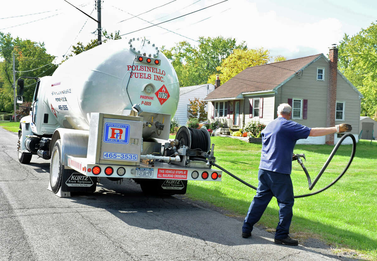 Polsinello Fuels employee David Sanders deliver propane to a home on Monday, Sept. 24, 2012 in East Greenbush, N.Y. (Lori Van Buren / Times Union)