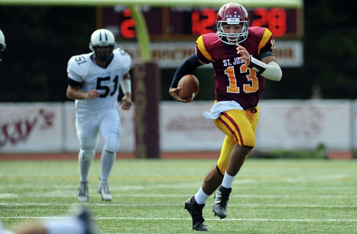 St. Joseph quarterback Jordan Vazzano runs for a 72-yard touchdown against Wilton on Saturday.
