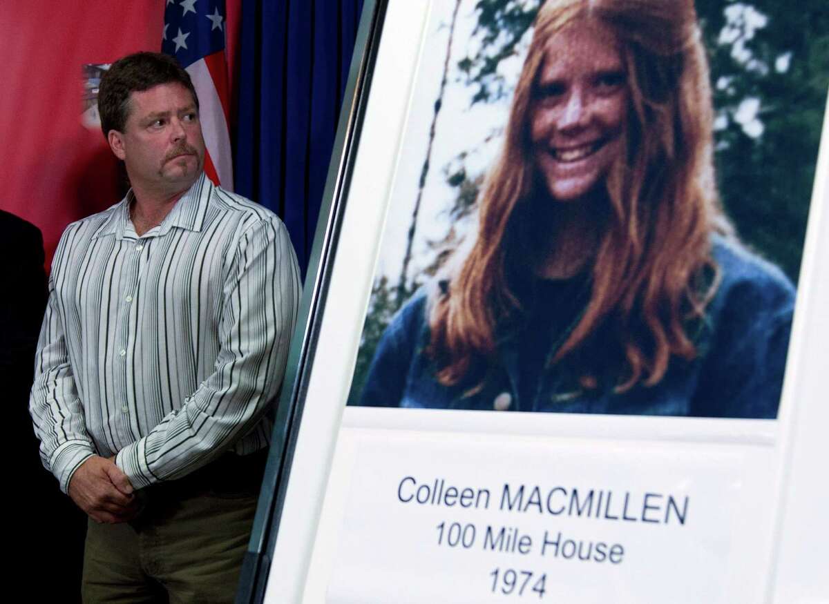 Shawn MacMillen, brother of murder victim Colleen MacMillen, is shown with a poster of his sister during a news conference in Surrey, British Columbia.