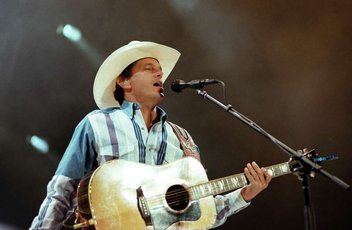 George Strait performs at the Alamodome in 1996.
