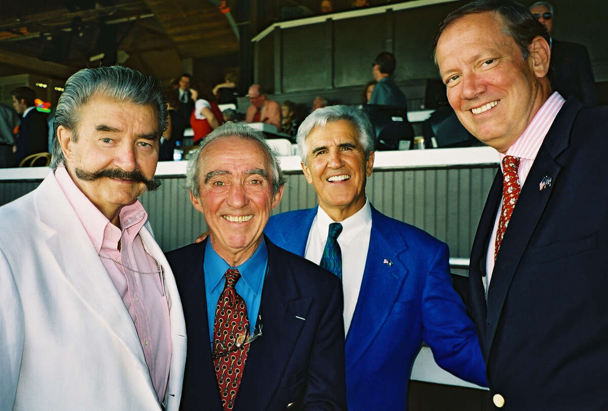 In this 2003 photo, artists, from left, LeRoy Neiman and Pierre "Peb" Bellocq stop by the governor's box to meet Gov. George Pataki, right, and state Sen. Majority Leader Joe Bruno before the 134th running of the Travers Stakes at Saratoga Race Course. (Times Union archive)