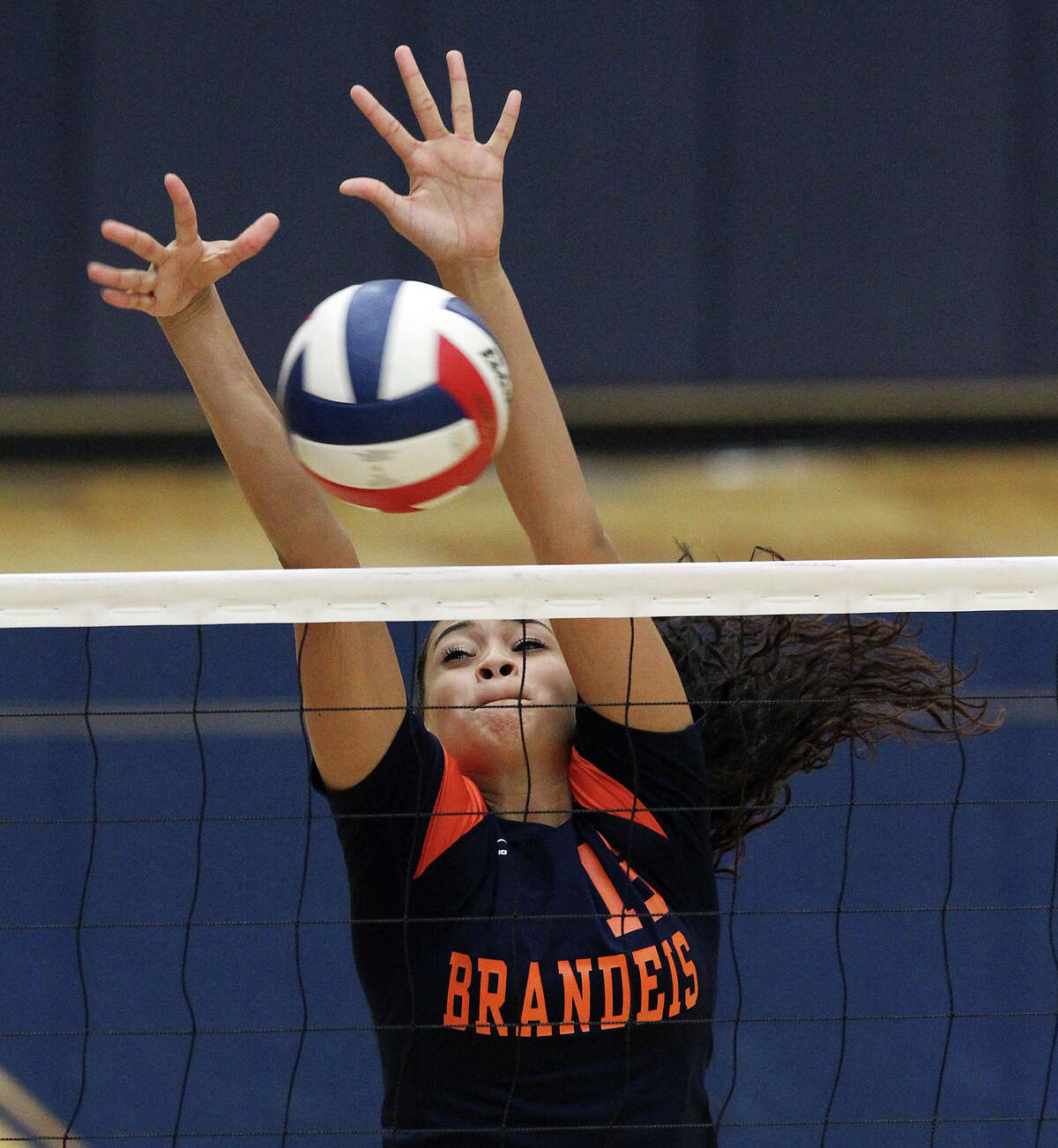 Brandeis' DeeDee Cardenas (13) makes a block against Warren in high school volleyball at Taylor Fieldhouse on Wednesday, Sept. 26, 2012.