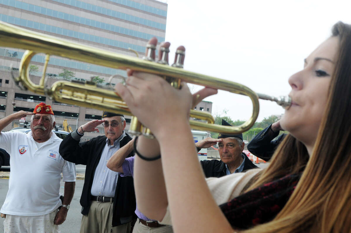 Westhill High School student Kayla McCabe performs Taps as, from left, Pat Battinelli, Sherwin Baer and Jack Halpert salute as Mayor Michael Pavia and the Stamford Jewish War Veterans hold a rededication ceremony of Tresser Boulevard, which was named in honor of the Private Samuel Tresser, outside the Government Center in Stamford, Conn., Sept. 27, 2012. Tresser enlisted in the Old Seventh Company, Connecticut Artillery Company, on May 13, 1915. He was killed in action at the Battle of St. Mihiel during World War 1 on August 24, 1918.