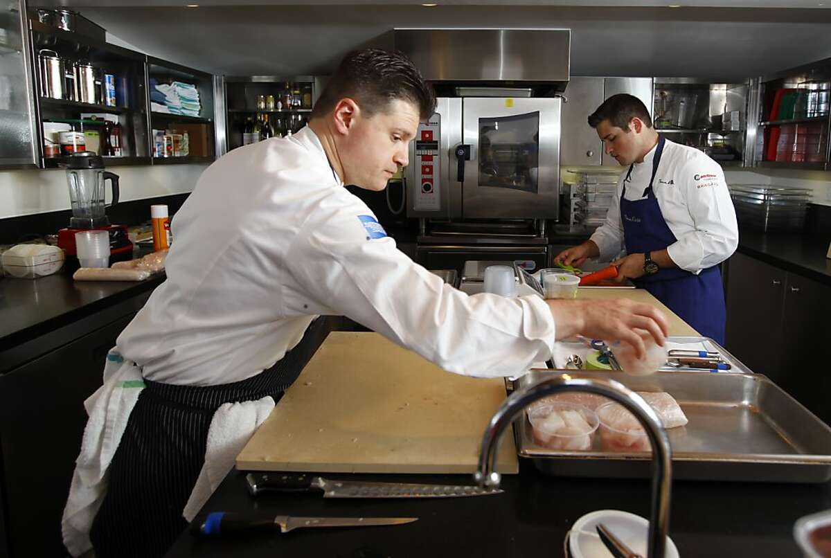 Richard Rosendale (left), executive chef at the Greenbrier resort in West Virginia, and Corey Siegel (right), Greenbrier commis chef, training for the Bocuse d'Or culinary competition at the French Laundry in Yountville, California, on Friday, September 21, 2012.