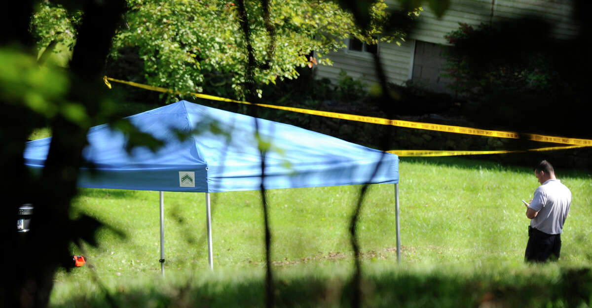 A blue tent protects the scene of a fatal shooting on Meeting House Hill Circle. Sources say a man shot his son, who was allegedly breaking into a relative's house.