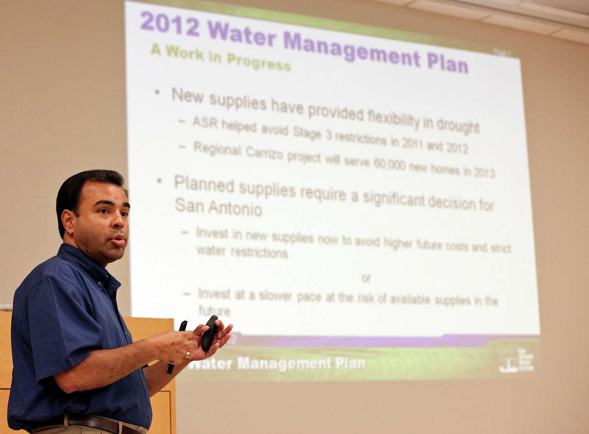 Greg Flores of SAWS speaks about the utility’s water plan at a public meeting Thursday. A SAWS survey found 74% of ratepayers favor water restrictions over planned rate hikes.