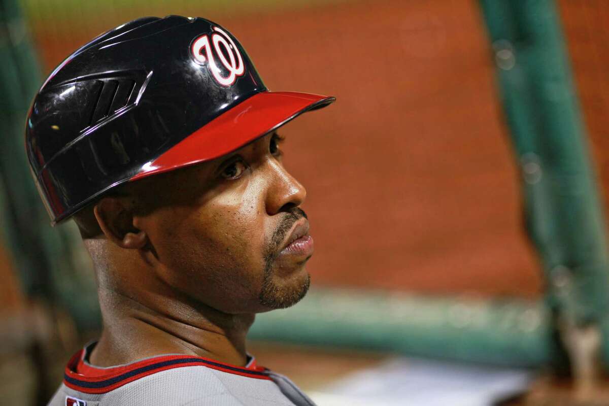 Washington Nationals' third base coach Bo Porter comes in from the field in the seventh inning against the Philadelphia Phillies, Thursday, Sept. 27, 2012 in Philadelphia.