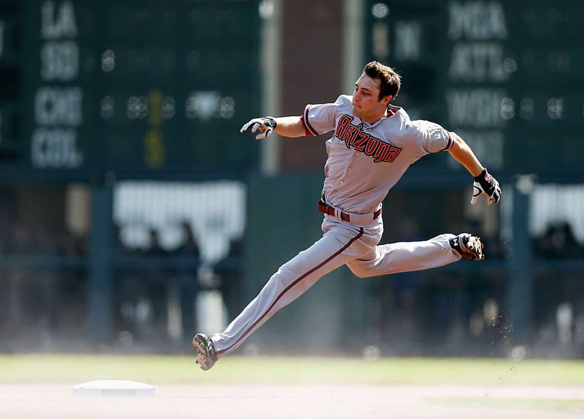 SAN FRANCISCO, CA - SEPTEMBER 27: A.J. Pollock #11 of the Arizona Diamondbacks rounds second base on his way to a lead off triple in the first inning of their game against the San Francisco Giants at AT&T Park on September 27, 2012 in San Francisco, California. (Photo by Ezra Shaw/Getty Images)