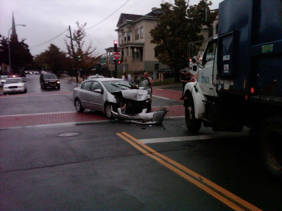 Troy man hurt in crash with city police car