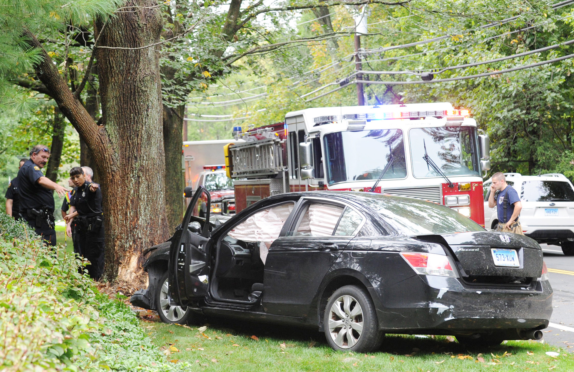 3 taken to hospital after car slams into tree on Round Hill Road