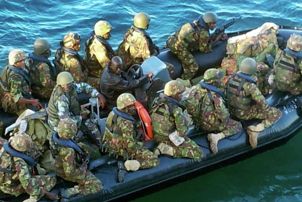 Kenyan troops, shown in a defense ministry photo, prepare to assault the Somali port city of Kismayo, the last stronghold of al-Shabab insurgents.