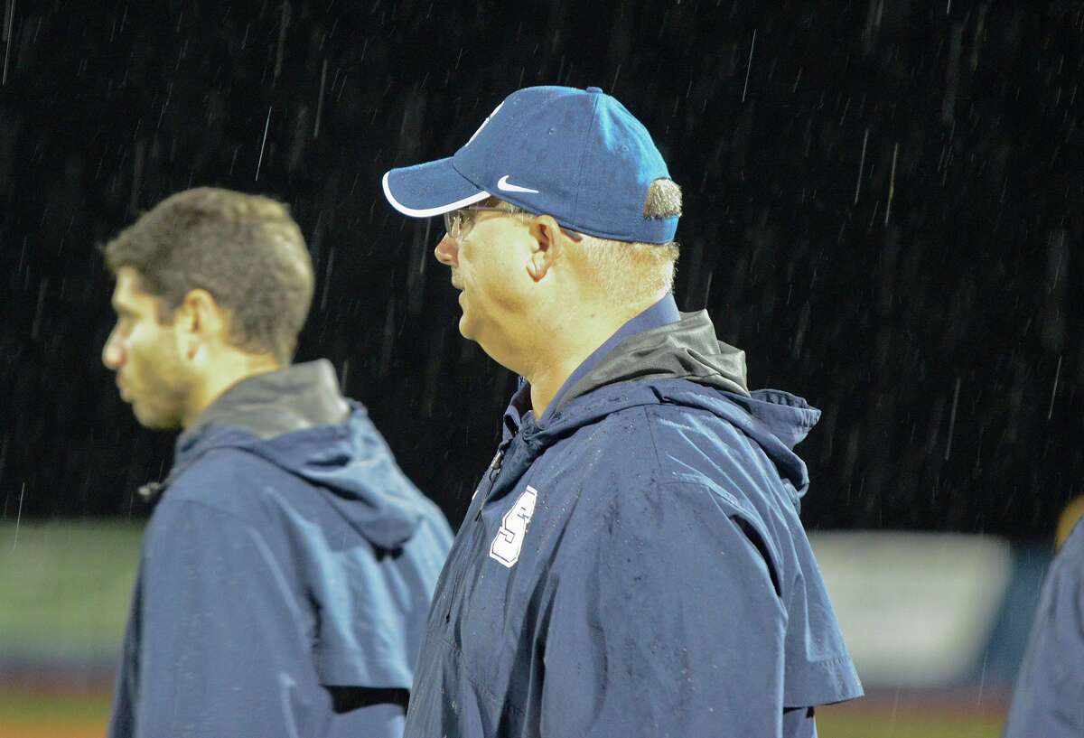 Staples coach Marce Petroccio watches from the sidelines as Staples High School hosts Brien McMahon High School in varsity football in Westport, CT on Sept. 28, 2012.