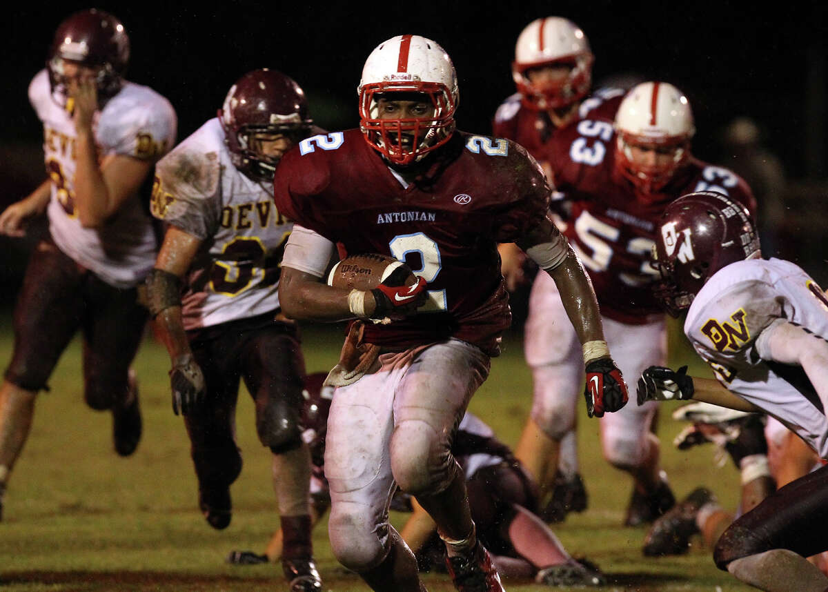 Antonian's Sterling Holmes (02) pulls away from the pack as he runs for extended yardage against Devine during their game at Antonian High School on Friday, Sept. 28, 2012.