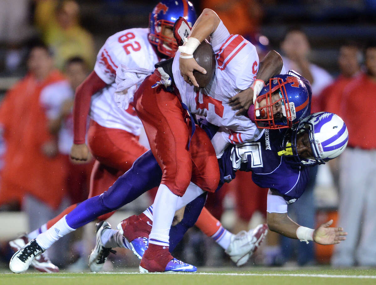 Jefferson's Mark Mangel (5) is tackled by Brackenridge's Kenneth May (85) after intercepting a ball during a high school football game between Brackenridge and Jefferson at Alamo Stadium in San Antonio, Friday, September 28, 2012. John Albright / Special to the Express-News.