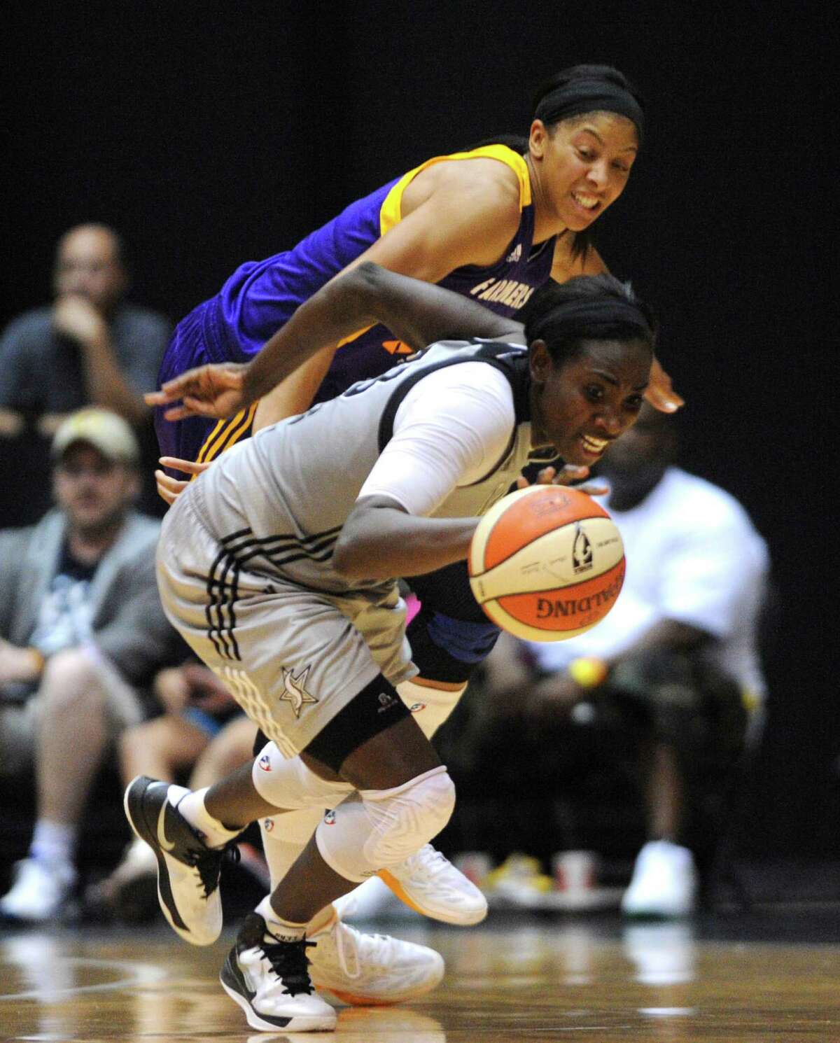 Sophia Young of the San Antonio Silver Stars beats Candace Parker of the Los Angeles Sparks to a loose ball during WNBA playoffs action at Freeman Coliseum on Saturday, Sept. 29, 2012.