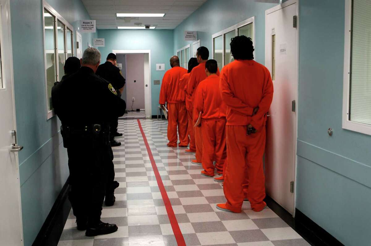 Sheriff’s deputies escort prisoners back to their cells after attending classes at San Francisco County Jail No. 5 in San Bruno in 2012.