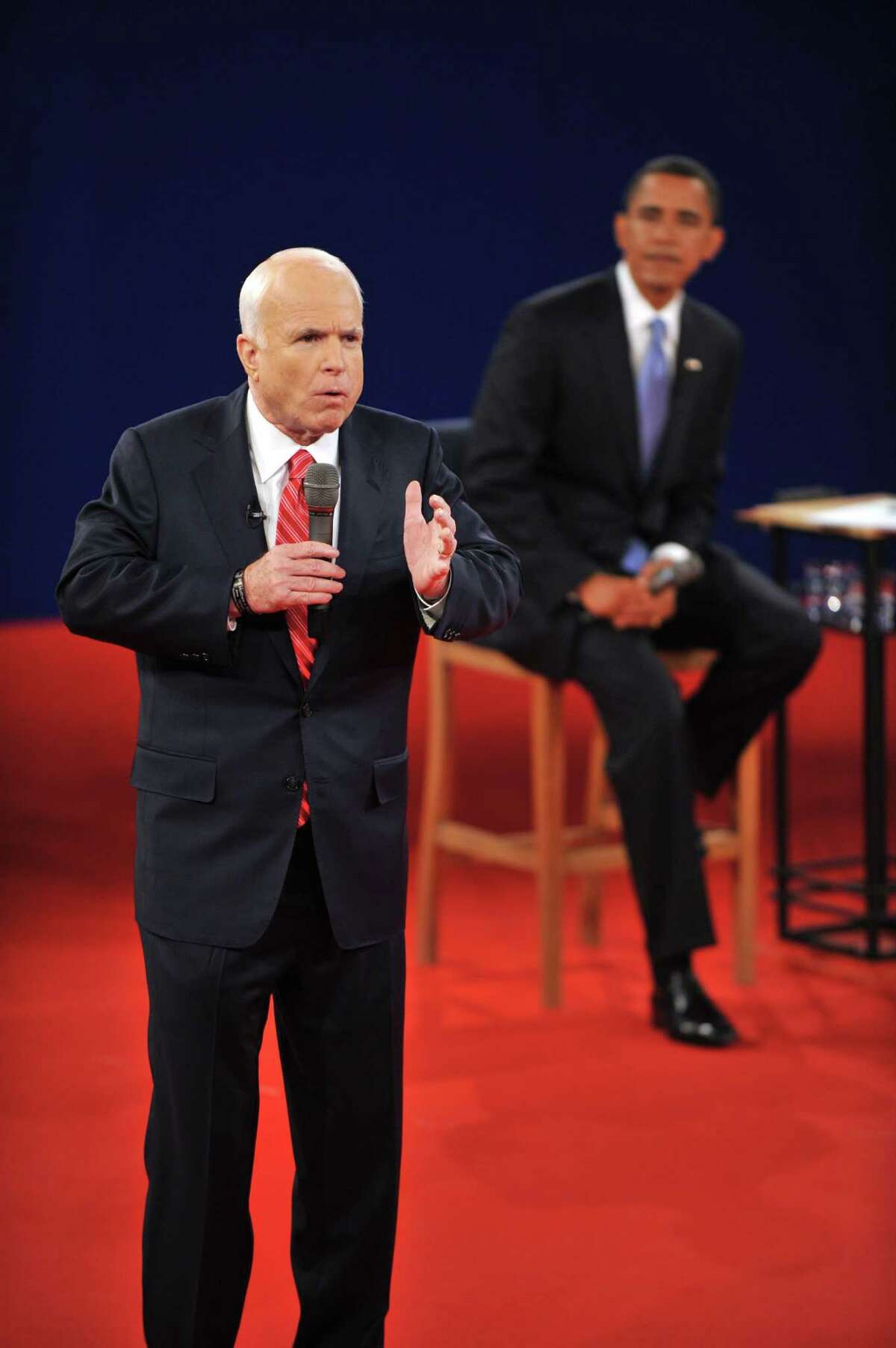 Republican John McCain makes a point as Democrat Barack Obama (R) listens during their second presidential debate at Belmont University's Curb Rvent Center on October 7, 2008 in Nashville, Tennessee. AFP PHOTO JIM WATSON (Photo credit should read JIM WATSON/AFP/Getty Images)