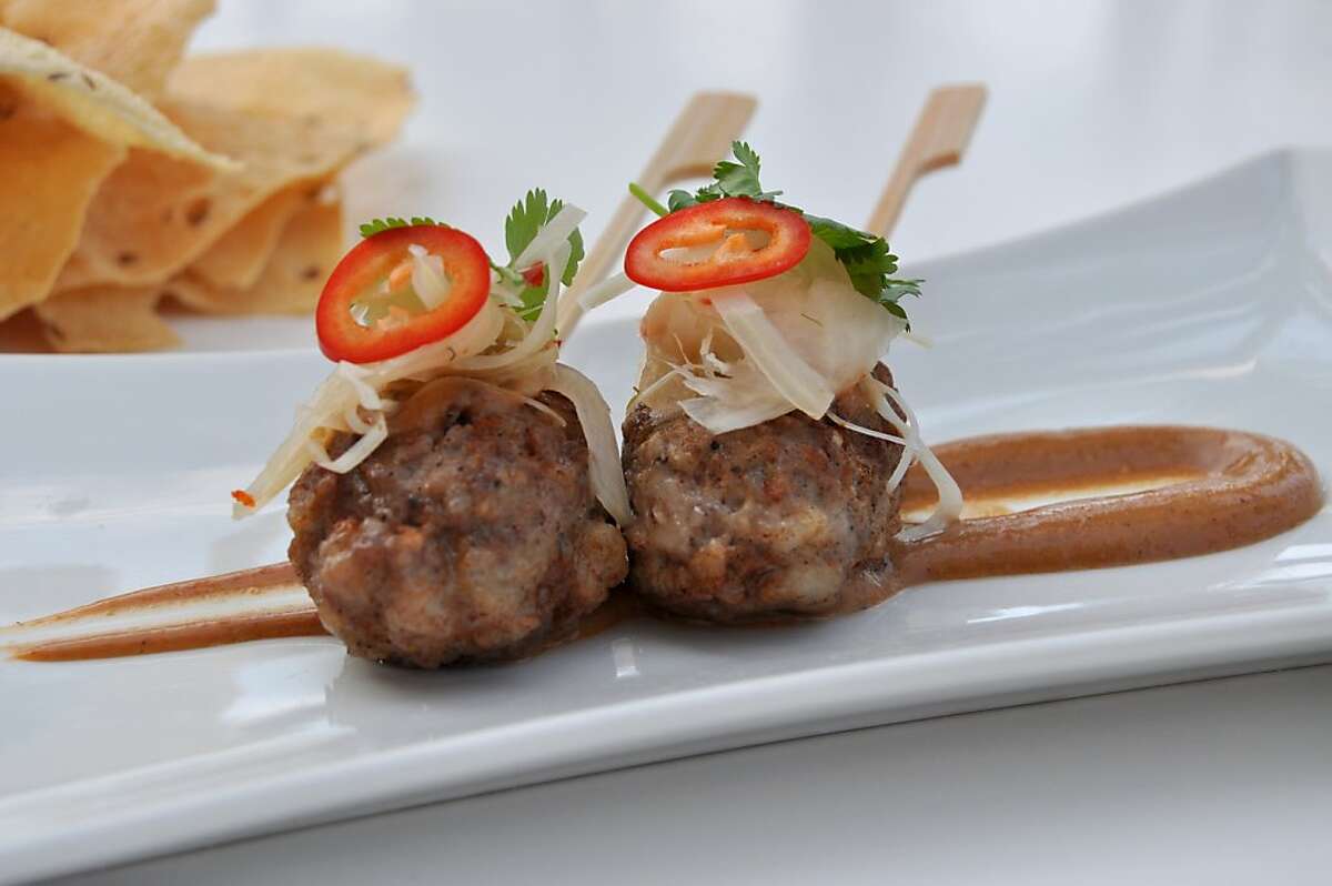 European and Asian influences come together in chef Alan Wong's skewered lamb and pork sausage with hoisin five-spice Greek yogurt, served at Amasia in the Grand Wailea on Maui.