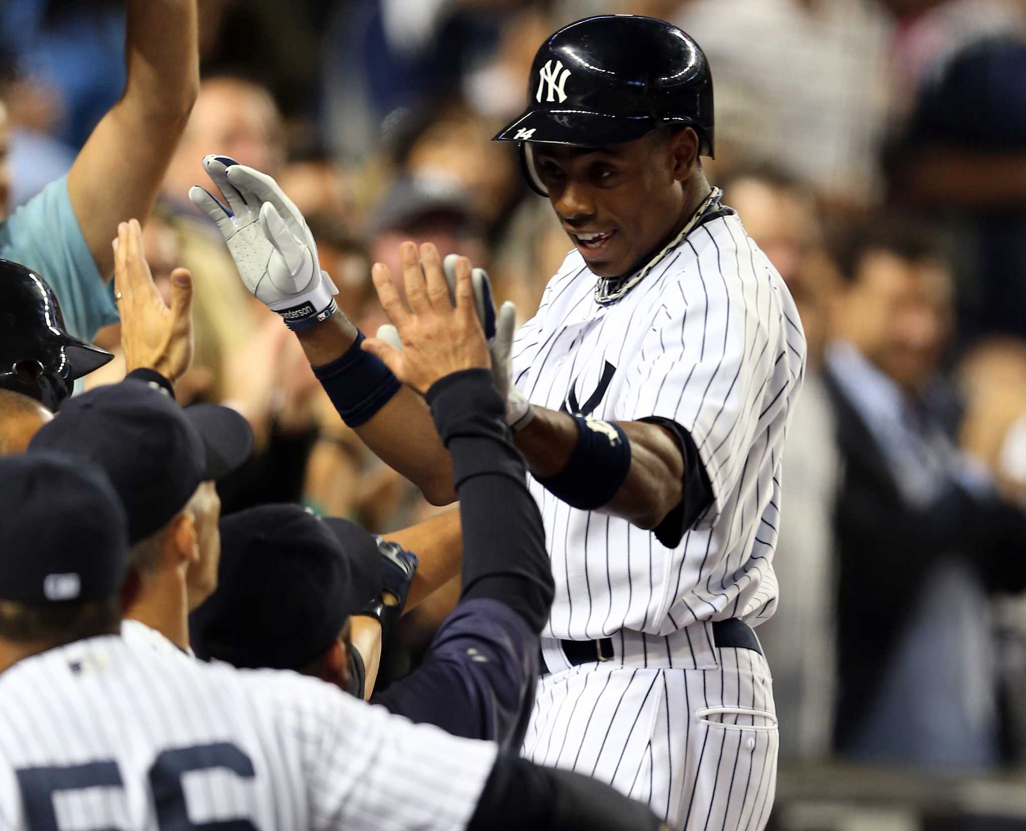 New York Yankees right fielder Nick Swisher (L) is congratulated