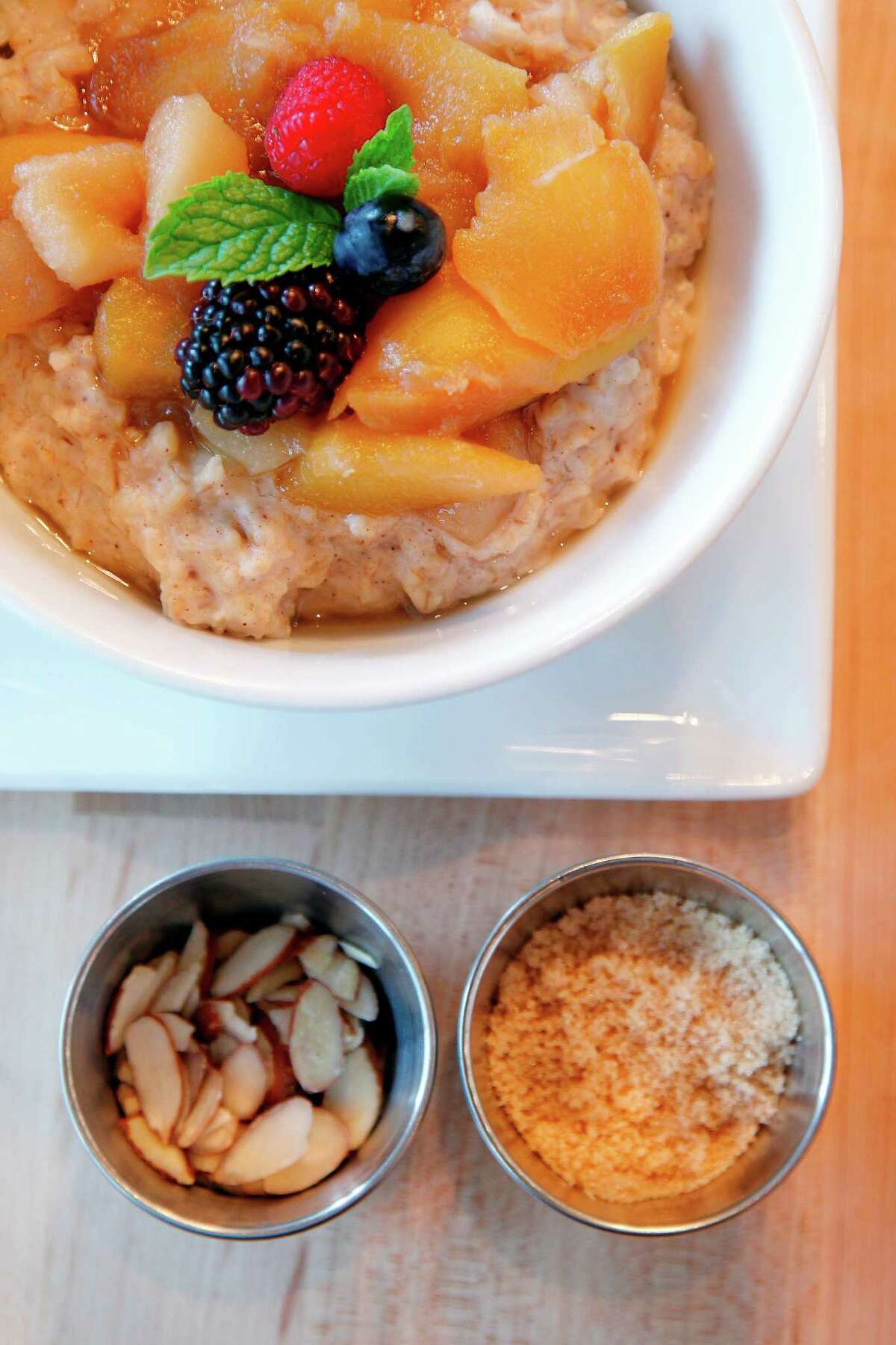 Steel-Cut Oats with Seasonal Fruit Compote comes with almonds and milk. on Thursday, Sept. 13, 2012, in Houston. Adair Kitchen serves American cuisine. ( Mayra Beltran / Houston Chronicle ) ( Mayra Beltran / Houston Chronicle )