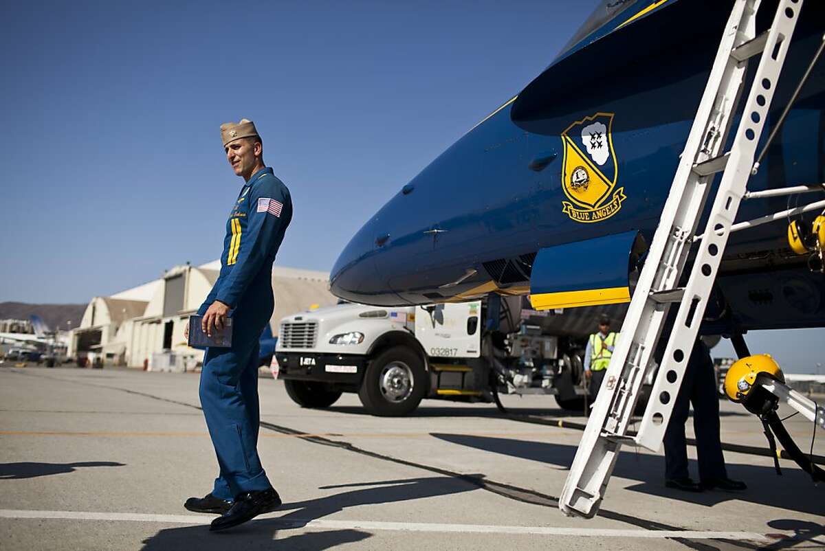 Navy Blue Angel Lt. Mark Tedrow on the tarmac at SFO after giving Nobel Prize winner in physics in 2011 and UC Berkley professor Alex Filippenko, in back, the ride of his life as part of their Key Influencer Program in Burlingame, Calif., Wednesday, October 3, 2012.
