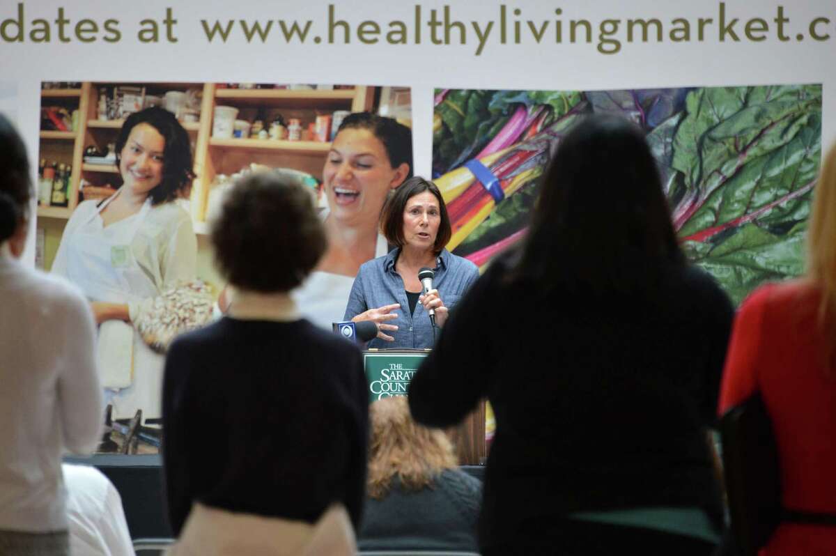 Healthy Living founder Katy Lesser, center, holds a news conference updating plans for a new natural and organic food market and cafe to open in early 2013, in the Wilton Mall Wednesday Oct. 3, 2012. .(John Carl D'Annibale / Times Union)