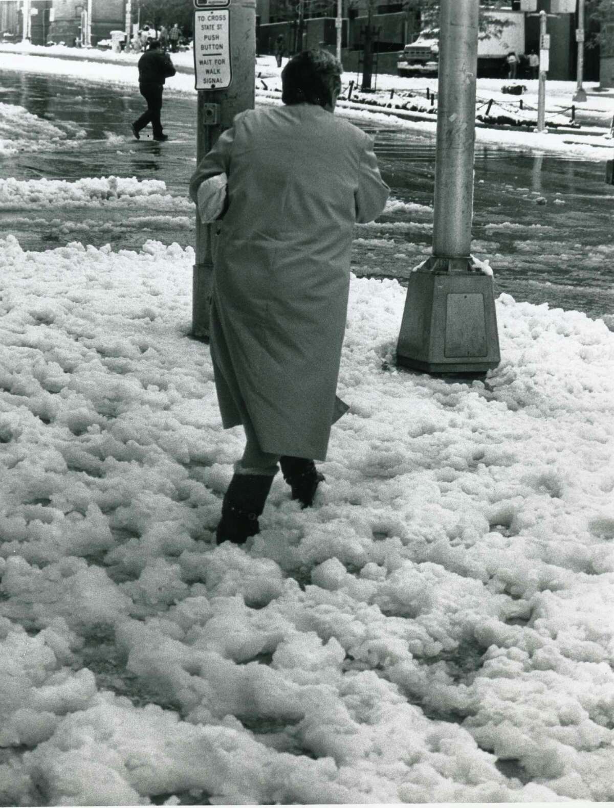 A pedestrian walks in the snow on State and Pearl Streets in Albany, NY, October 4, 1987 (Jack Madigan Archives / Times Union)