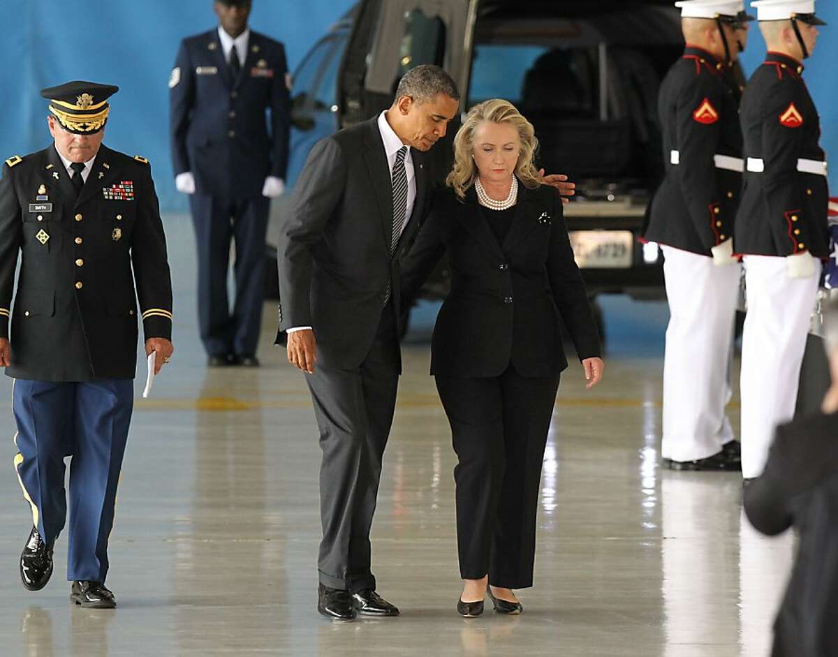 JOINT BASE ANDREWS, MD - SEPTEMBER 14: U.S. President Barack Obama and U.S. Secretary of State Hillary Clinton walk away from the podium during the Transfer of Remains Ceremony for the return of Ambassador Christopher Stevens and three other Libyan embassy employees at Joint Base Andrews September 14. 2012 in Joint Base Andrews, Maryland. Stevens and the three other embassy employees were killed when the consulate in Libya was attacked September 11. (Photo by Molly Riley-Pool/Getty Images) *** BESTPIX ***
