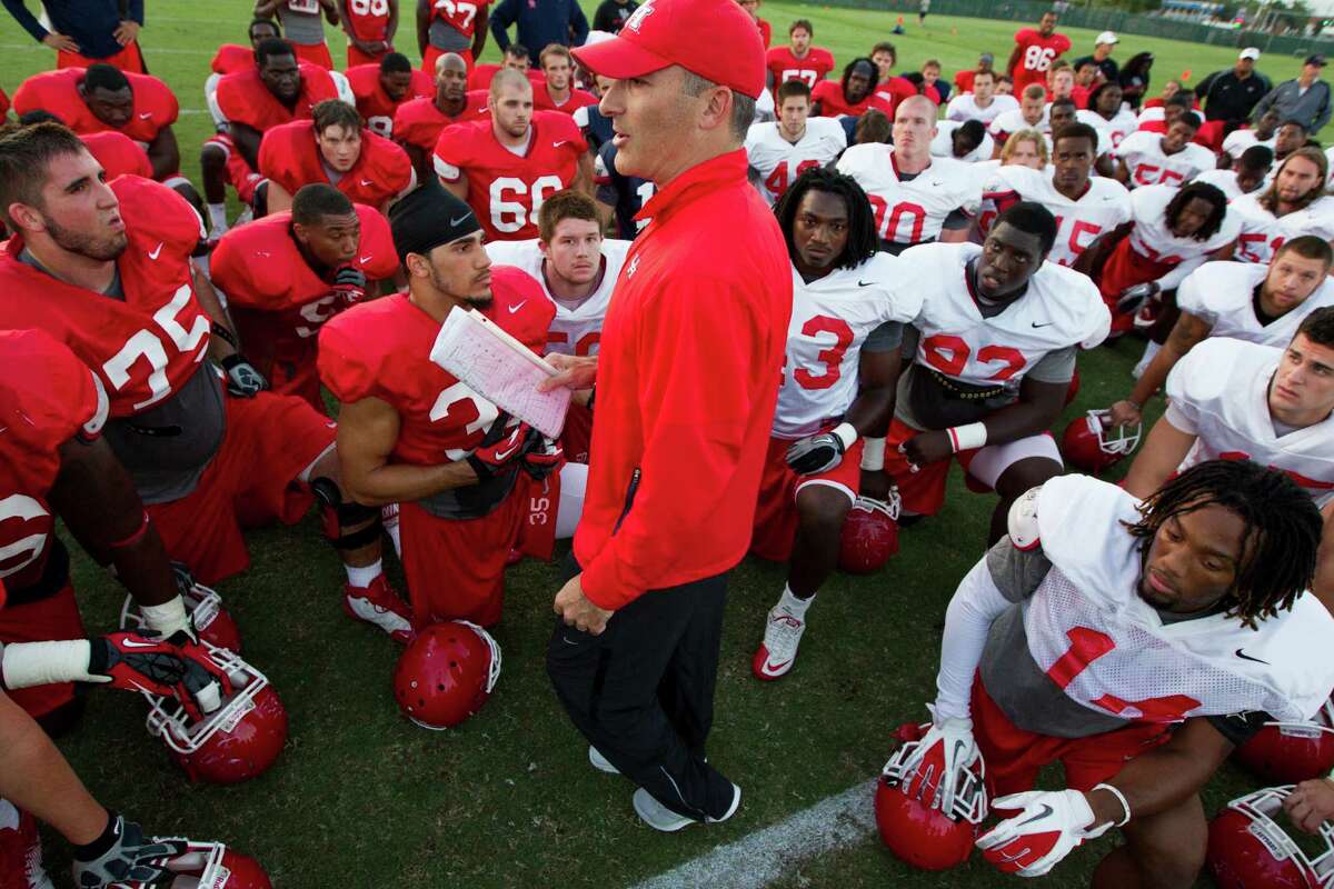 University of Houston head football coach Tony Levine talks with his team after practice on Monday, Oct. 1, 2012, in Houston.