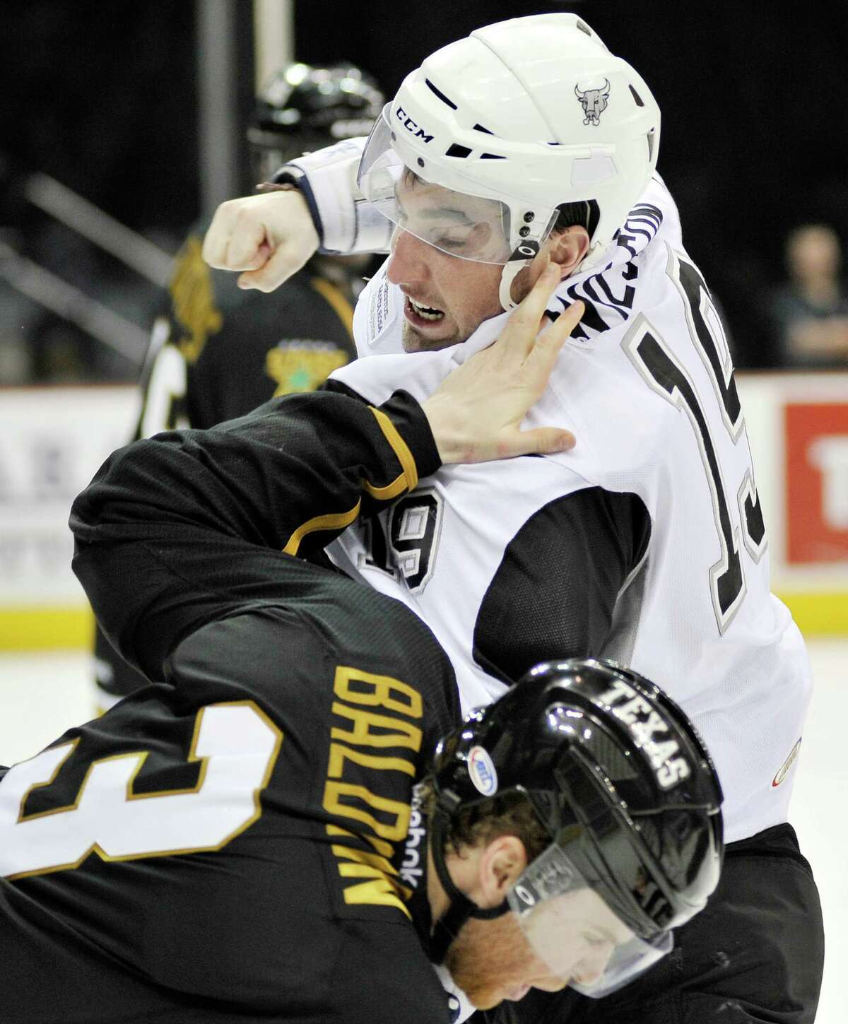 San Antonio Rampage's Garrett Wilson, top, punches Texas Stars' Gord Baldwin during the second period of an AHL hockey game, Friday, Jan. 25, 2013, in San Antonio.