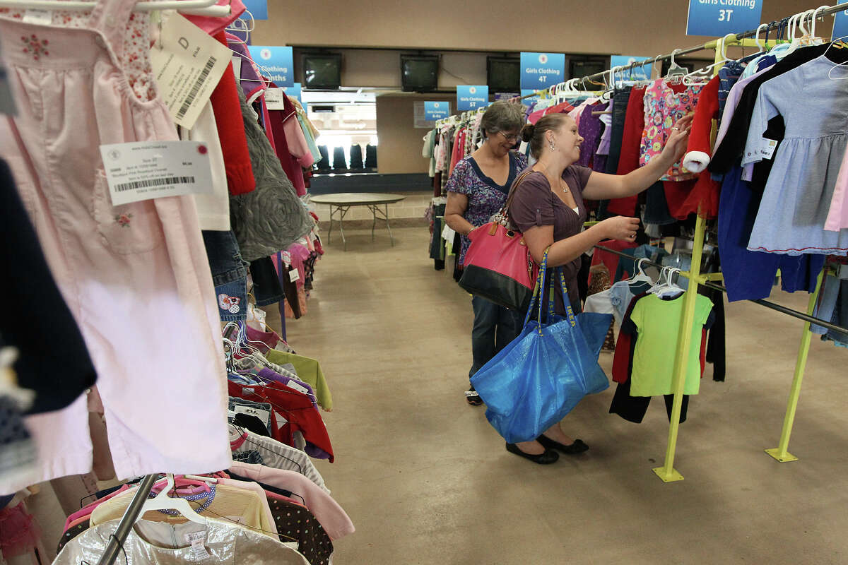 Customers Danielle Hudson (right) and her mother, Barbara Hudson, look for clothing for Danielle's daughter at a recent Kid's Closet Connection sale at Retama Park on Saturday, Sept. 29, 2012. The business sells children's clothing and related items on consignment. They plan on running a sale twice a year which features items geared for children.
