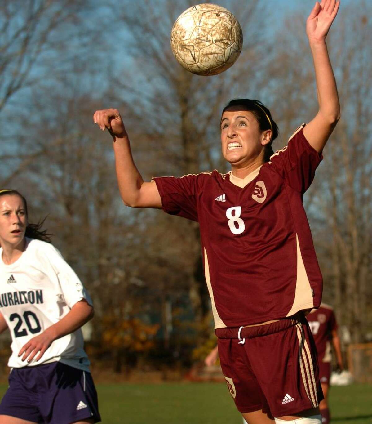 St. Joseph's Jessica Schloth heads the ball as Lauralton Hall's Nicole Peterson looks on during Monday's Class M state tournament game at Lauralton Hall in Milford. St. Joseph won the game 2-0.