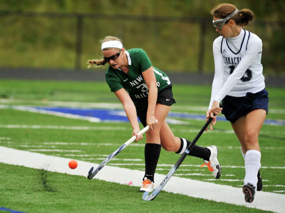New Milford's Brianna Reda hits the ball past Immaculate's Katherine Archer during their game at Immaculate High School in Danbury on Tuesday, Oct. 9, 2012. New Milford won, 4-0.