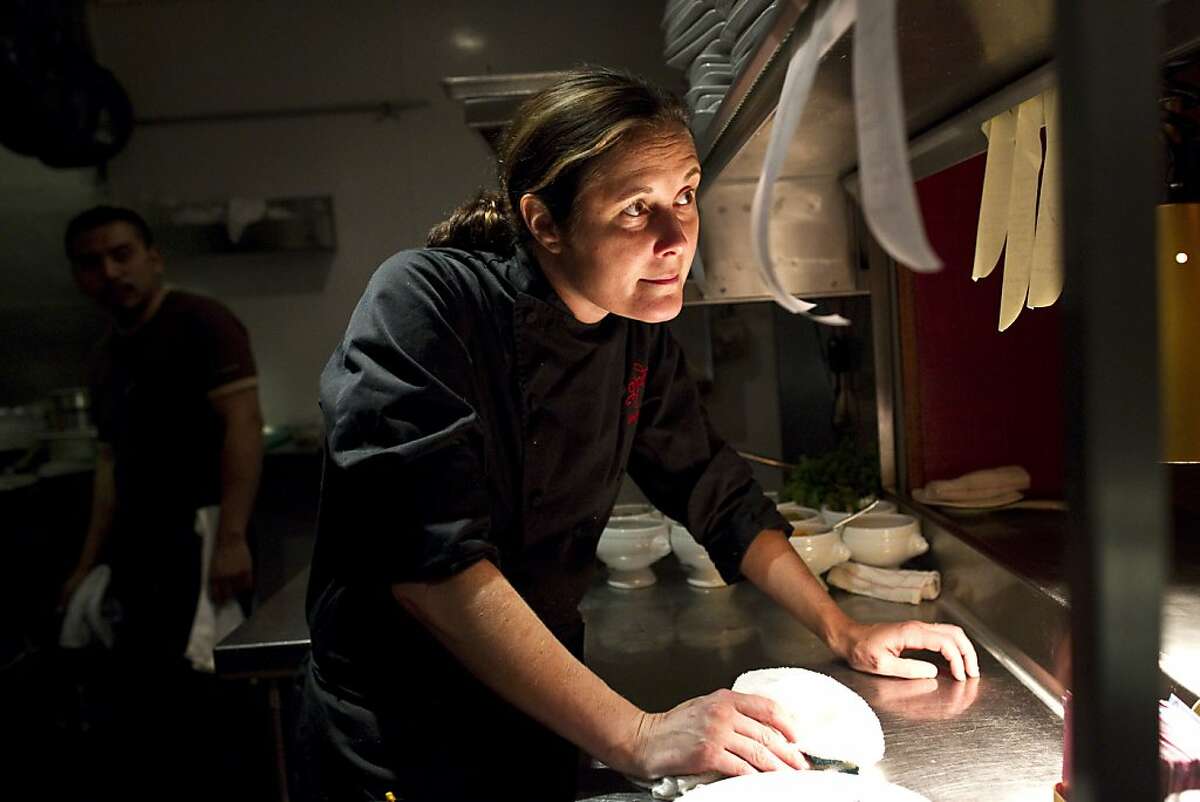 Gitane Executive Chef Bridget Batson talks with the manager while working at the restaurant in San Francisco, Calif., on Thursday, October 28, 2010.