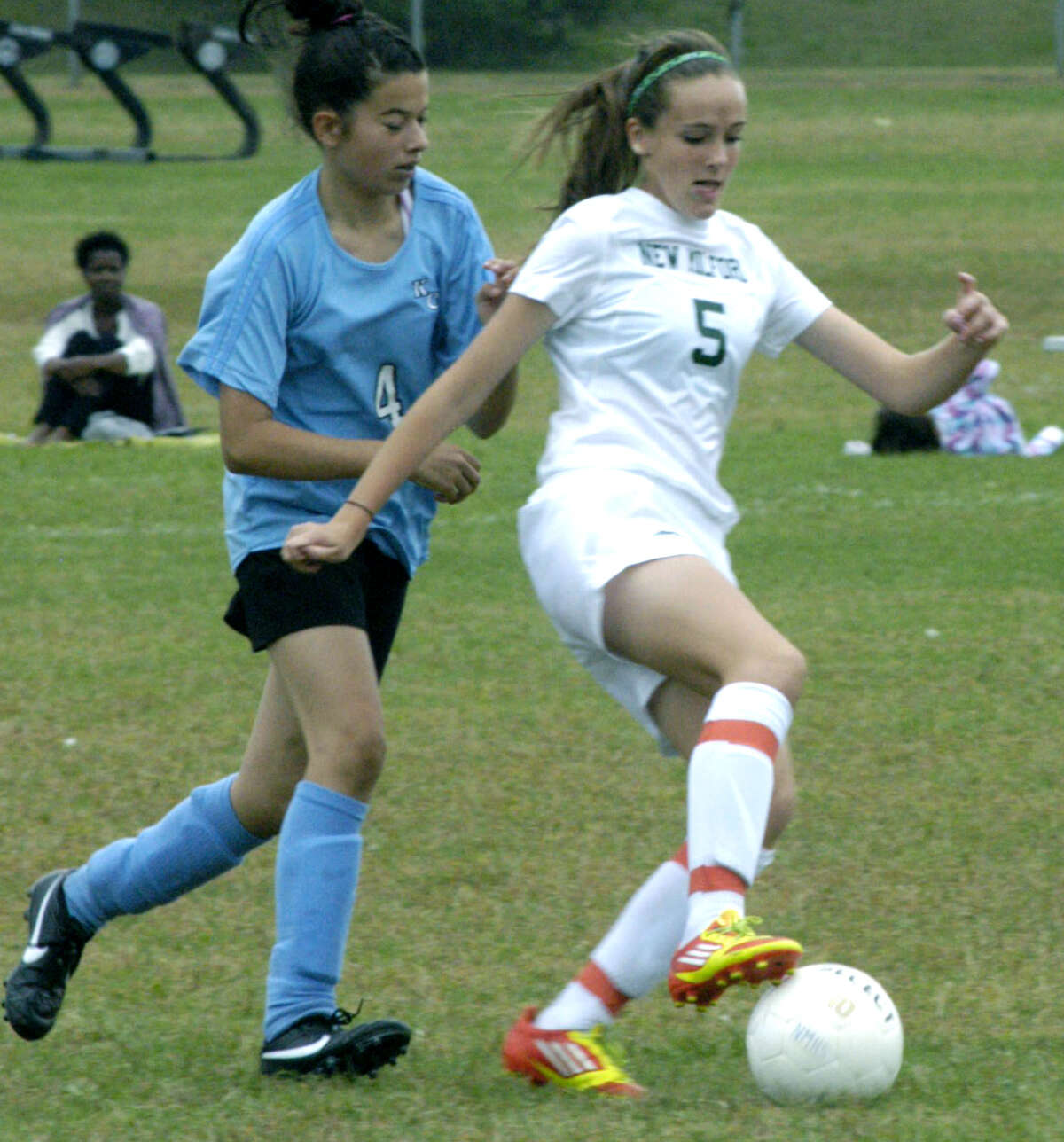 The Green Wave's Rachel Weir demonstrates her foot skills to a rival during New Milford High School girls' soccer's Sept. 22, 2012 match vs. Kolbe Cathedral at NMHS.