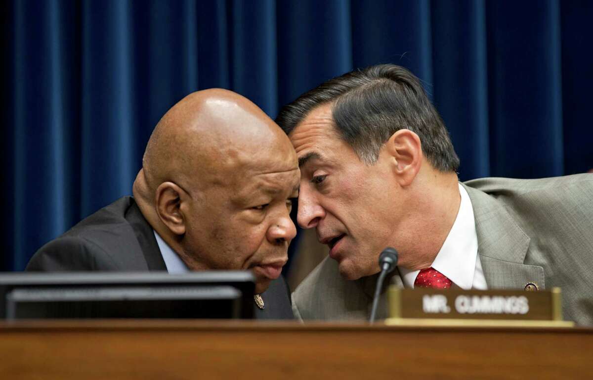 House Oversight Committee Chairman Rep. Darrell Issa, R-Calif., right, confers with the committee's ranking Democrat, Rep. Elijah Cummings, D-Md., on Capitol Hill in Washington, Wednesday, Oct. 10, 2012, during the committee's hearing to investigate the Sept. 11, 2012 attack on the American consulate in Benghazi, Libya that resulted in the death of U.S. Ambassador Christopher Stevens, (AP Photo/J. Scott Applewhite)