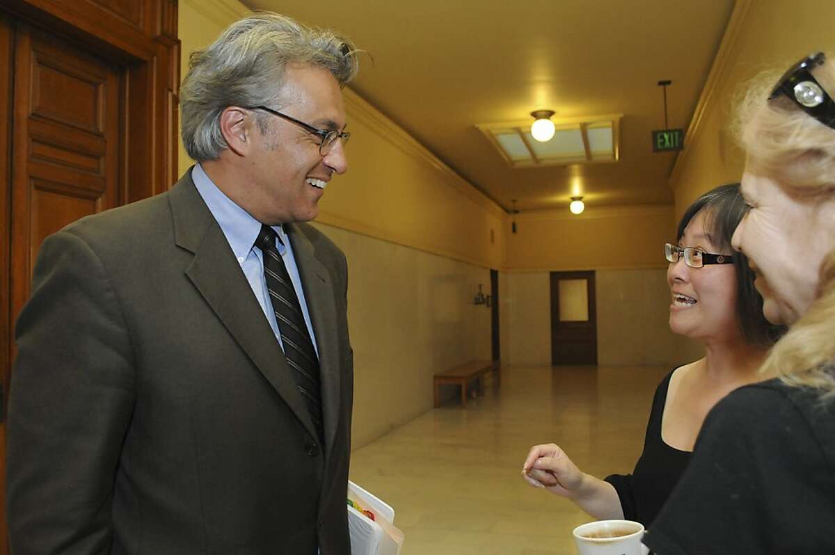 Reinstated Sheriff Ross Mirkarimi greets City Hall employees outside of his office Wednesday, Oct. 10, 2012.