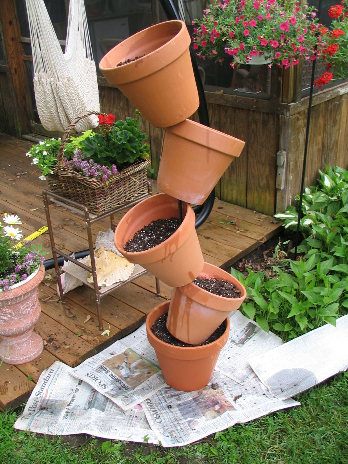 Heads up: Herbs thrive in tipsy terra-cotta tower