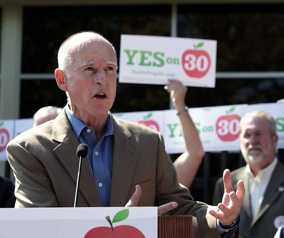 FILE - In this Aug 15, 2012 file photo, Gov. Jerry Brown kicks off his campaign for Proposition 30, a November ballot initiative that would temporarily increase sales and income taxes, during his visit to New Technology High School in Sacramento, Calif. Brown quest for voters is being challenged by Molly Munger, a wealthy liberal-leaning Los Angeles civil right attorney who is backing her own tax initiative Proposition 38. (AP Photo/Rich Pedroncelli, file)