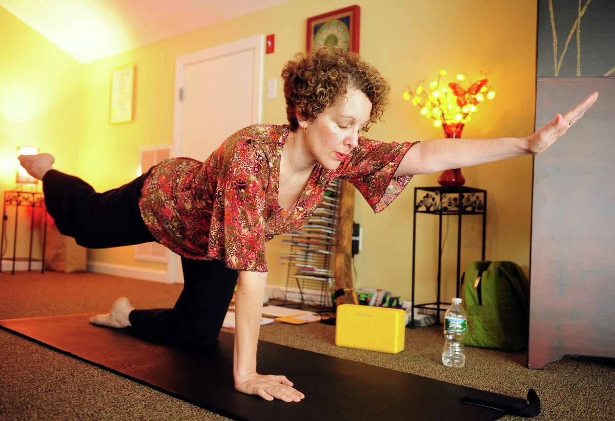 Linda Antignani leads a Gentle Hatha Yoga class Wednesday, Oct. 10, 2012 at Mother's Embrace Yoga Studio in Shelton.