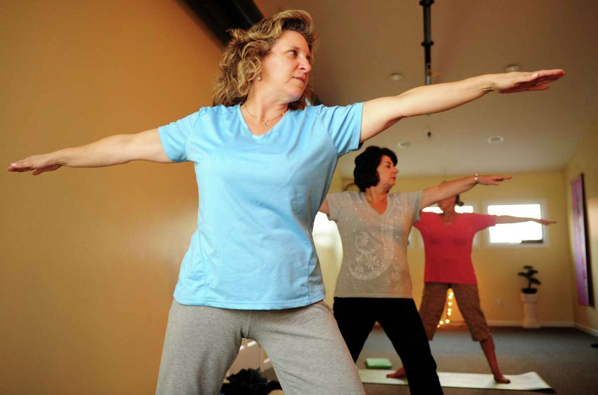 Charice Aube takes a Gentle Hatha Yoga class Wednesday, Oct. 10, 2012 at Mother's Embrace Yoga Studio in Shelton.