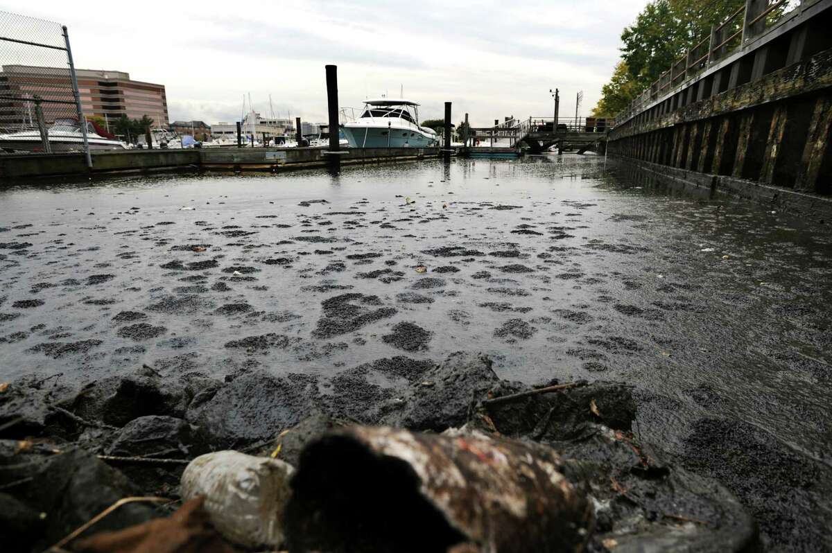 A large sewage spill created a big mess and spread throughout the upper part of the East Branch of the Harbor around Czescik Marina and the nearby city wastewater treatment plant in Stamford, Conn. on Friday, Oct. 12, 2012. The spill appears too large to contain and when the tide turns, the floating, stinking mounds of effluent will be swept into the Sound.