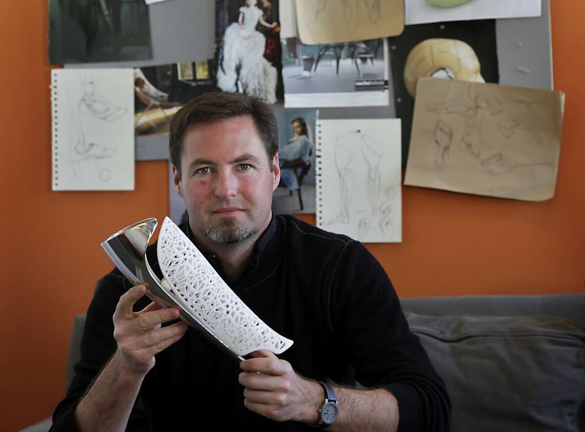 Bespoke founder Scott Summit holds one of his innovative fairings Thursday May 19, 2011. Bespoke Innovations is a San Francisco, Calif. company that features custom-tailored prosthetic leg covers or fairings.