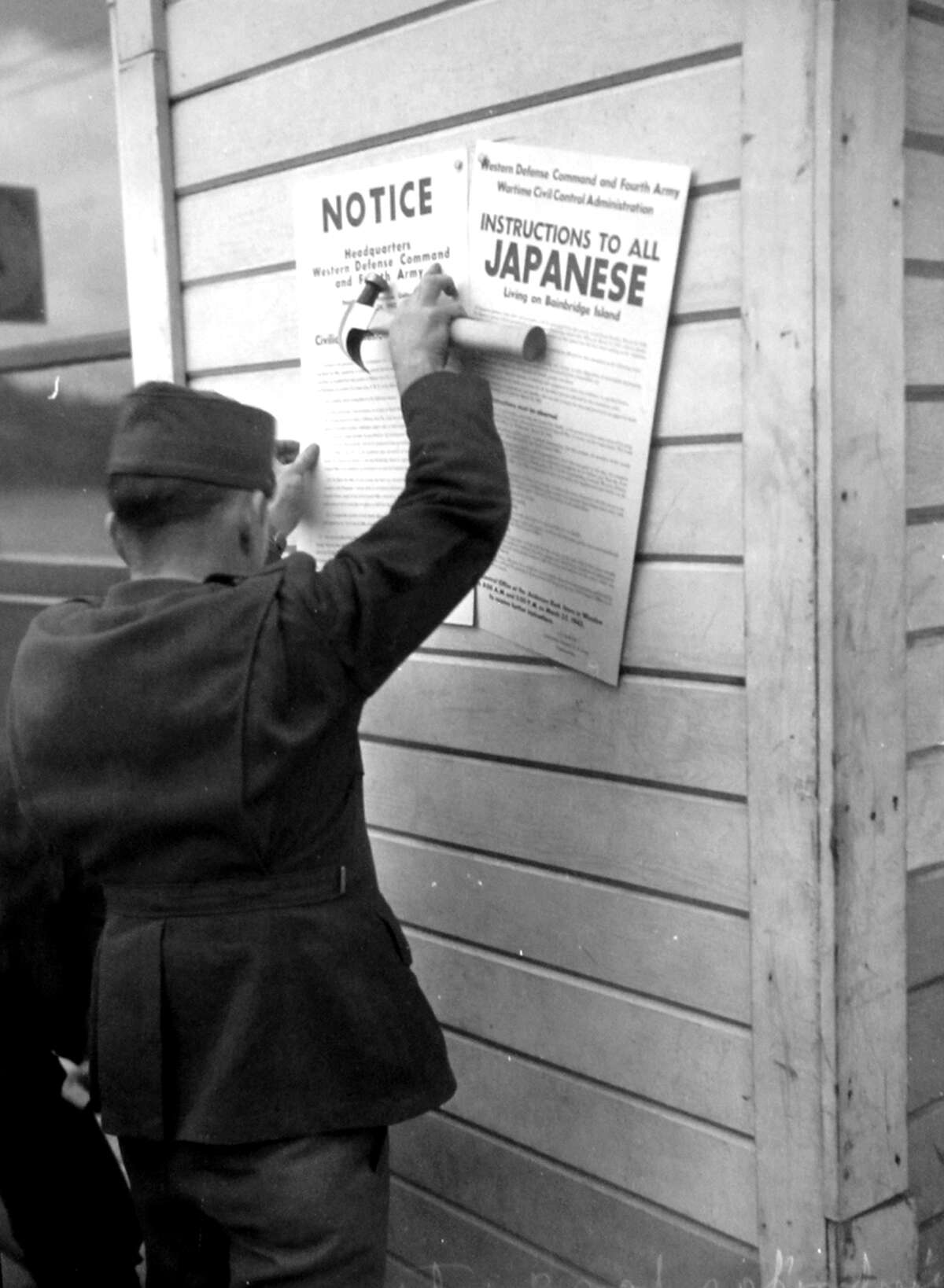 This picture was taken in 1942 after Japanese Americans were taken to internment camps, as ordered in February of that year by President Franklin Roosevelt. The following month a P-I photographer followed 225 people were left Bainbridge Island for internment camps. A few of these images have never been published, and since 1976 the P-I negatives have been carefully preserved at the Museum of History and Industry.