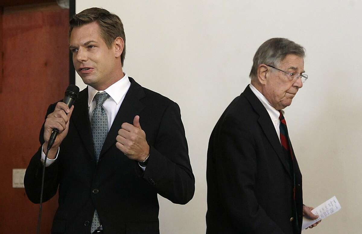 In this photo taken Sept. 7, 2012, California Rep. candidate Eric Swalwell speaks at left as Rep. Pete Stark, D-Calif. walks off the stage during an Alameda County Democratic Lawyers Club endorsement meeting at Everett & Jones Barbeque in Oakland, Calif. Pete Stark is used to coasting to re-election in the liberal enclave of the San Francisco Bay area he has represented since the end of the Vietnam War. Legislative gerrymandering kept him in a heavily Democratic district, and California's primary system virtually ensured that he would emerge to face Republican or fringe-party challengers with almost no chance of beating him in November. All that has changed this year, as Californians deal with two major political reforms that are remaking the congressional landscape and creating competitive races for the first time in many years. (AP Photo/Jeff Chiu)